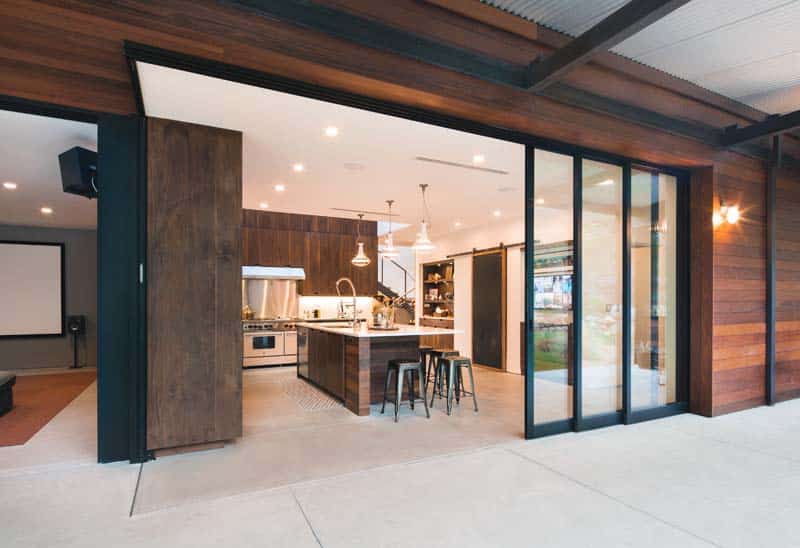 Multi-slide telescopic glass doors in a luxury villa living room