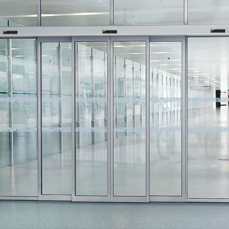 Multi-slide telescopic doors installed in a modern commercial office
