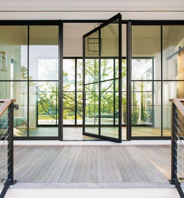 Large glass pivot door with aluminium frame