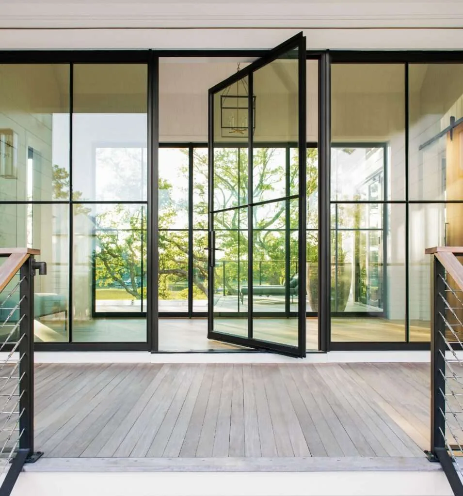 Large glass pivot door with aluminium frame