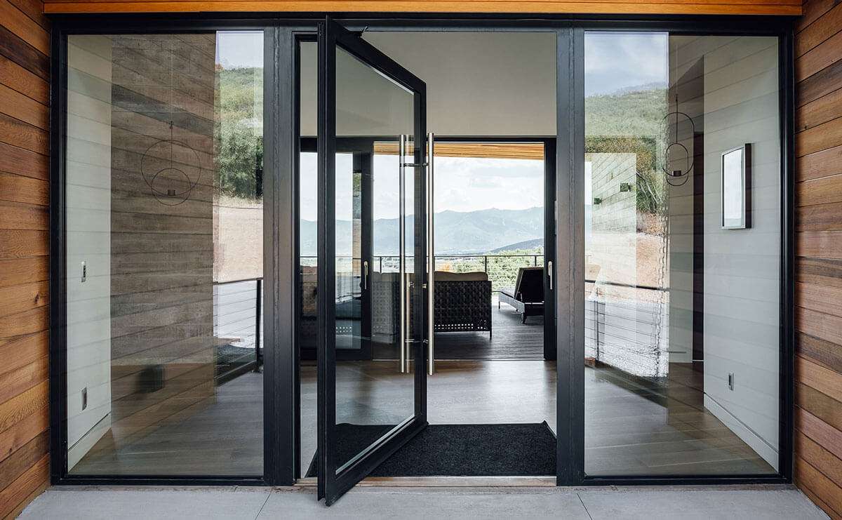 Elevate your entryway with a modern aluminium pivot door, offering a smooth rotation and premium aesthetic.