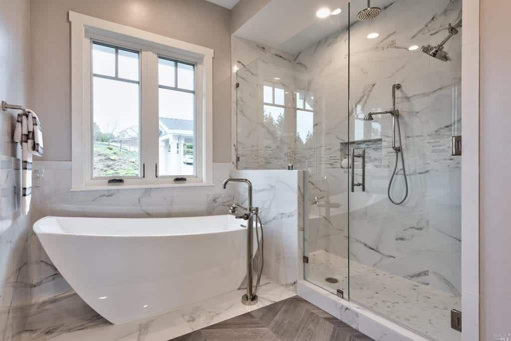 Frameless shower glass partition in a modern bathroom