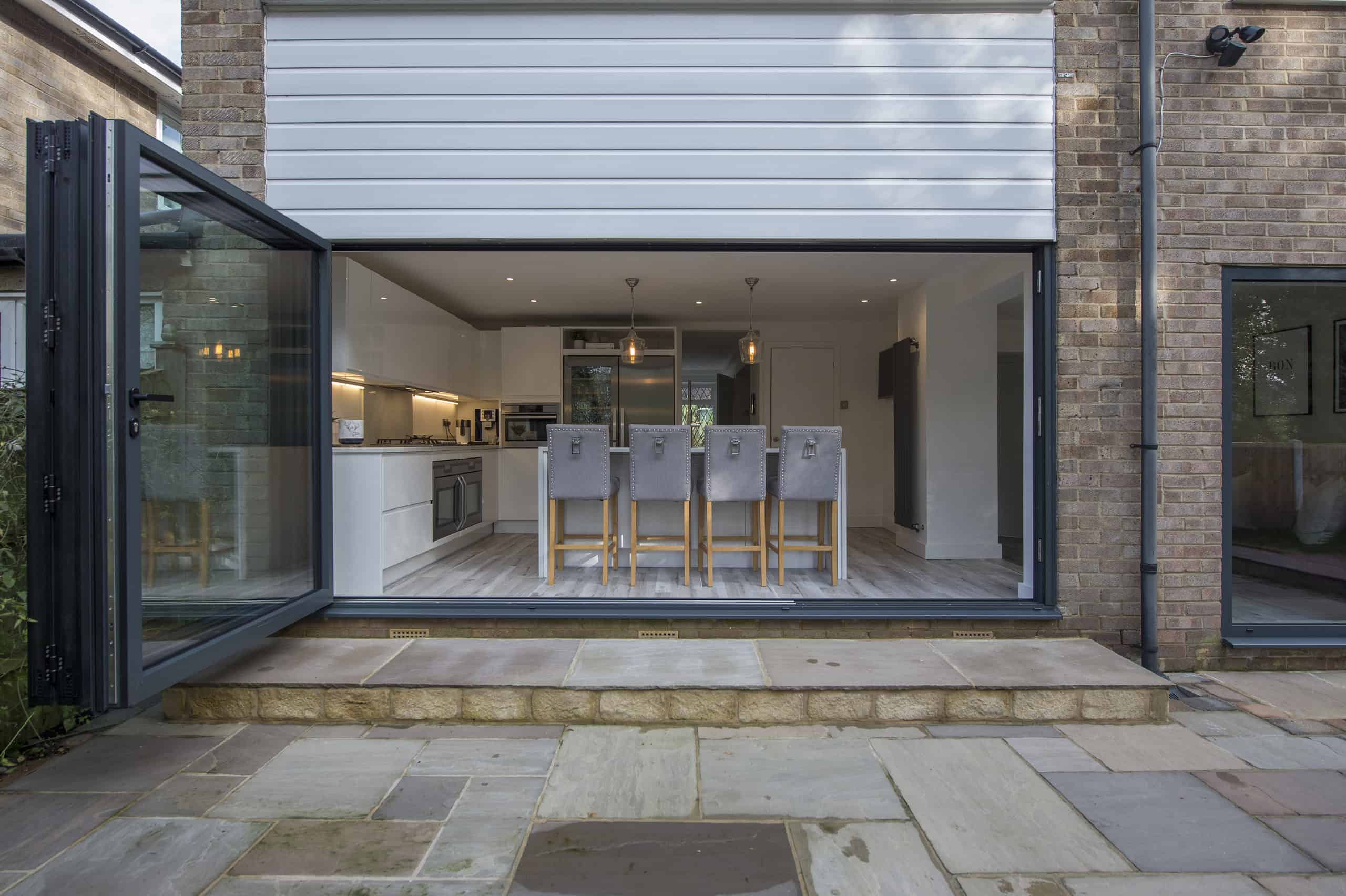 Maximize space and light in your office with ultra slim bi-fold doors, ensuring modern aesthetics and functionality.