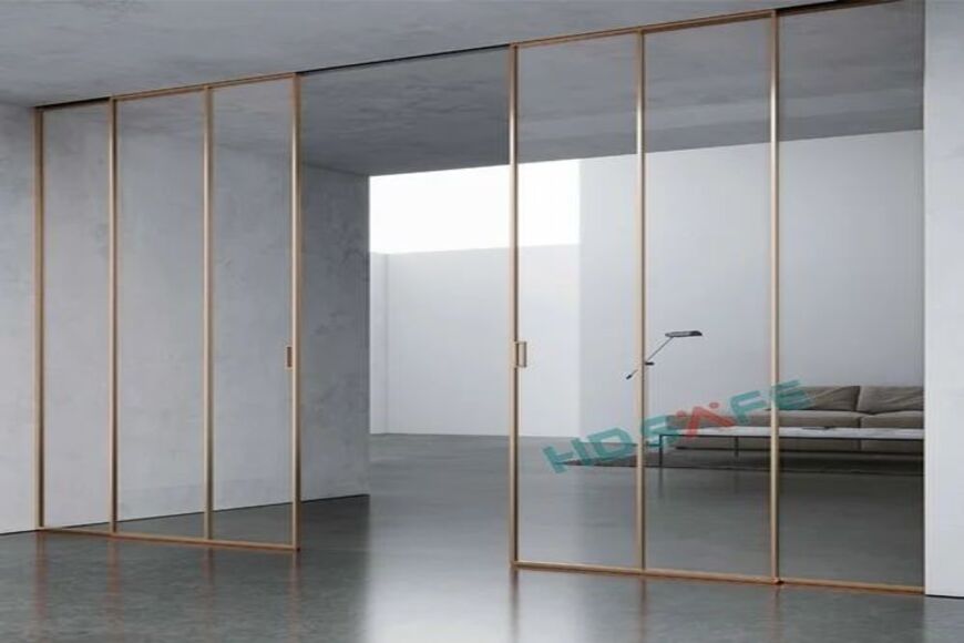 A spacious living area featuring multi-slide telescopic doors, fully opened to create a seamless transition between the indoor and outdoor spaces, enhancing natural light and modern aesthetics.