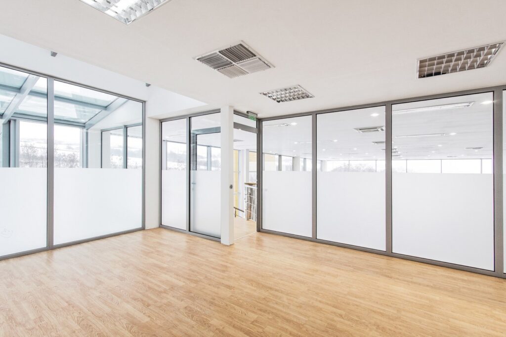 Frameless glass partition in a contemporary home interior