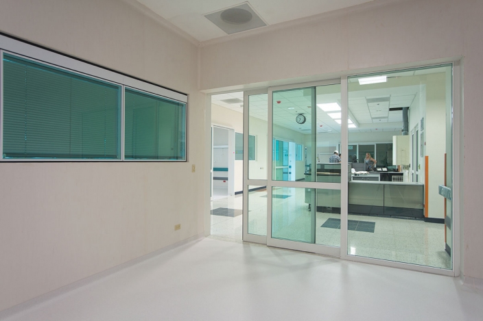 Automatic sliding glass door installation in a modern commercial building in Dubai