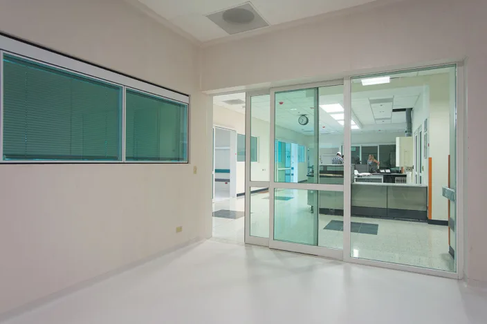 Automatic sliding glass door installation in a modern commercial building in Dubai