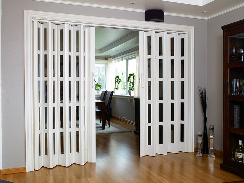 PVC folding door installed in a stylish modern living room.