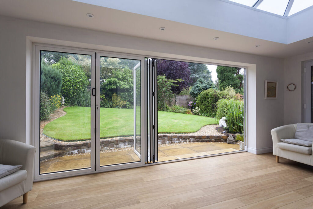 Sleek accordion doors used as a flexible office partition.