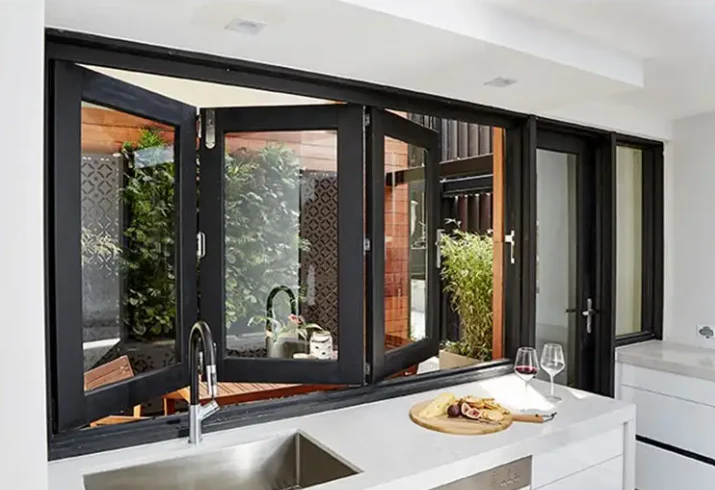 Custom folding window doors in a luxurious Dubai villa opening to a patio.