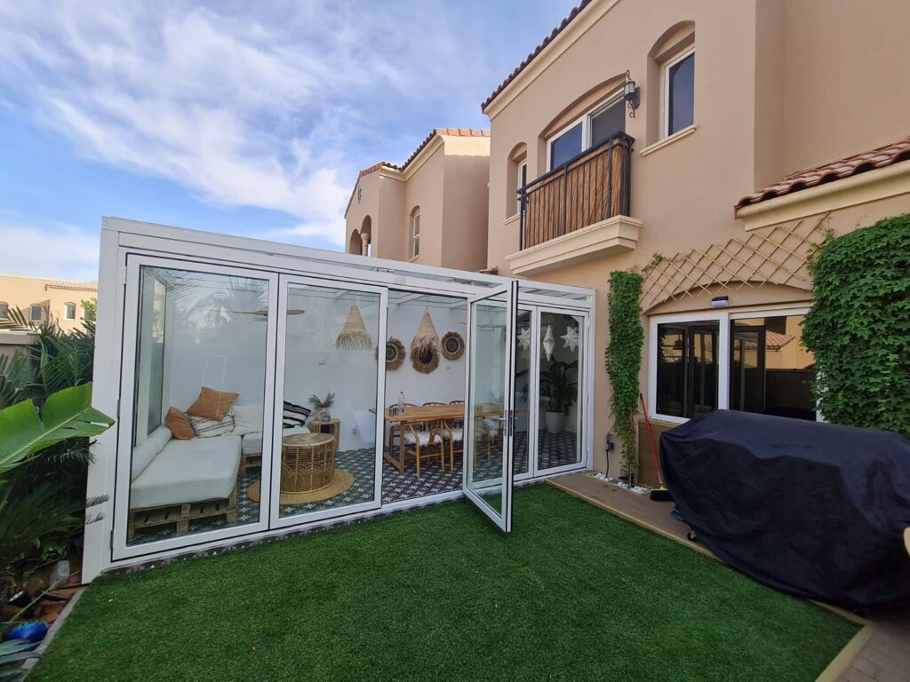 Glass patio doors in Dubai providing a clear view to the garden and outdoor area.