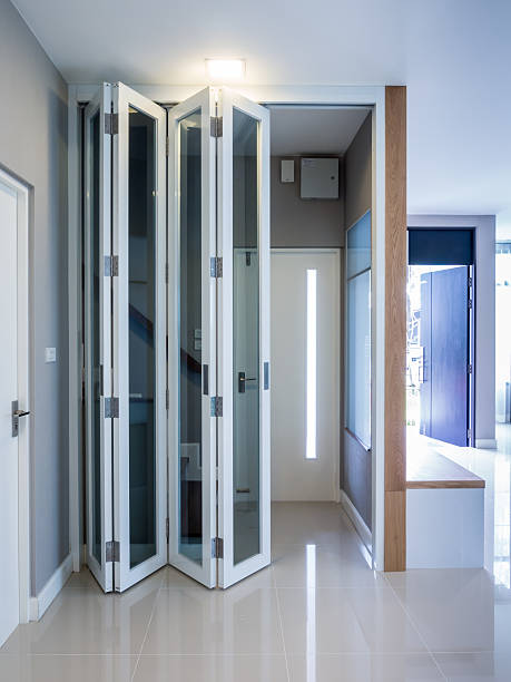 Contemporary sliding bifold doors with glass panels for natural light.