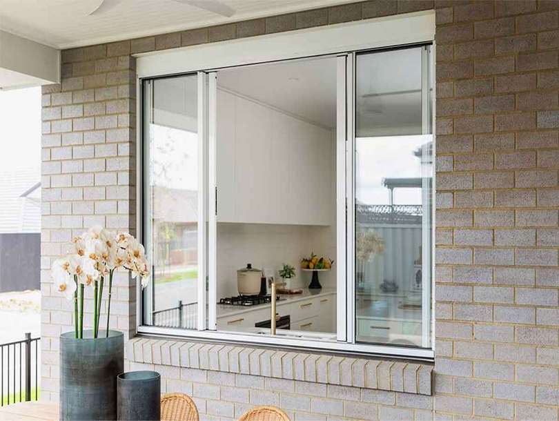 Aluminium sliding windows with slim frames allowing natural light into a modern home