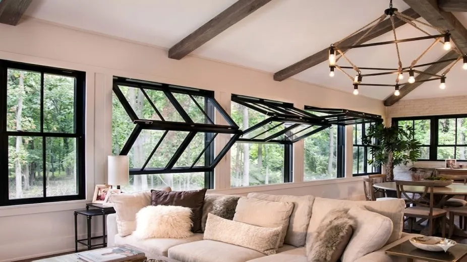 Motorized vertical bifold doors with remote control showing overhead panel stacking in Dubai apartment balcony