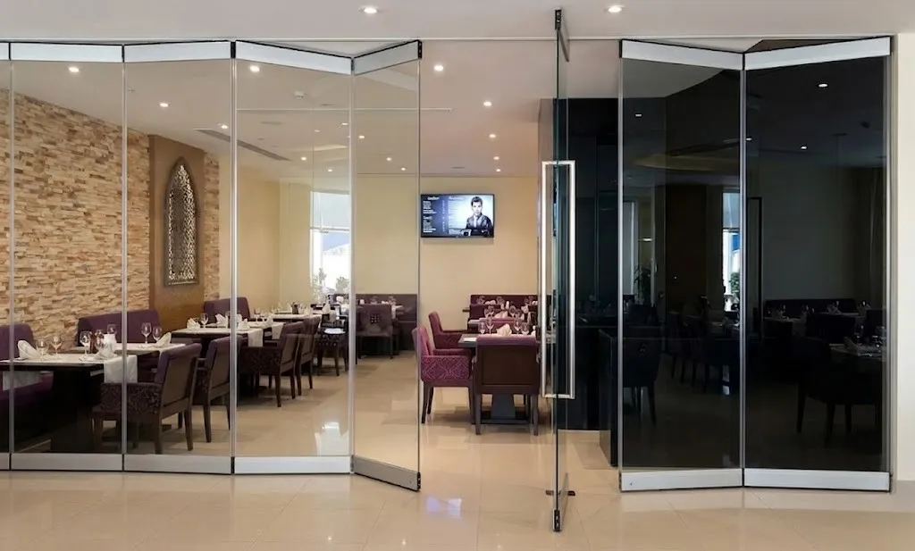 Frameless bifold pricing showing various panel configurations from 2-panel to 8-panel systems with costs and glass specifications